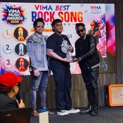 Diorama receiving the VIMA award on stage